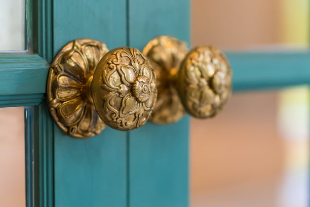 Victorian Style brass door knob on green garden room door