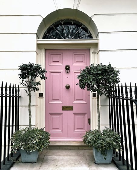 Pink Exterior Door With Door Knocker and Centre Knob
