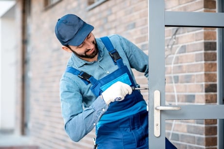 A man installing fire-rated door handle